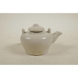 A Chinese cream glazed porcelain teapot, 3½" diameter