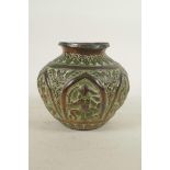 An Indian copper pot with repousse figural decoration, 5" high