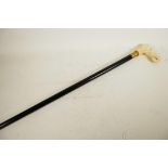 A hardwood walking stick, the bone handle carved as an elephant's head, 33" long