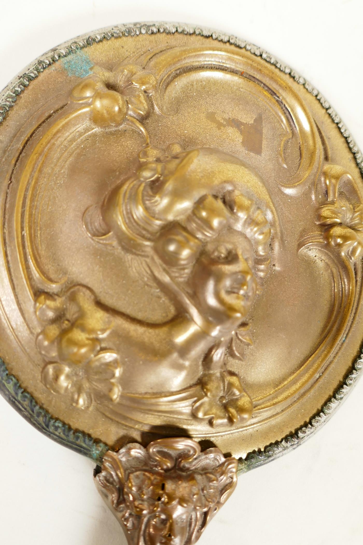 A C19th Art Nouveau bronze hand mirror embossed with scrolls and faces, and bejewelled glass mirror, - Image 3 of 4
