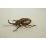 A Japanese Jizai style bronze rhinoceros beetle trinket box, 3½" long