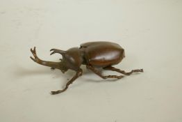 A Japanese Jizai style bronze rhinoceros beetle trinket box, 3½" long