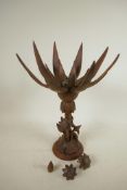 An oriental mid C20th wooden lotus flower metamorphic table lamp, with carved floral base and double