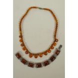 An amber beaded necklace, and a silver and faux amber bracelet, 16" long