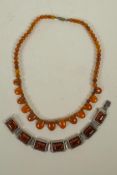 An amber beaded necklace, and a silver and faux amber bracelet, 16" long