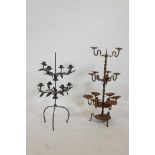 A wrought iron eight branch candelabra with trailing leaf decoration, together with a thirteen