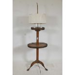 A mahogany lamp table with pierced galleries, raised on tripod supports, 55" high, A/F