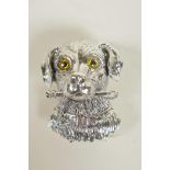 A silver pendant/brooch in the form of a dog's head