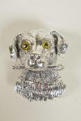 A silver pendant/brooch in the form of a dog's head