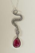 A 925 silver pendant necklace in the form of a marcasite encrusted snake with a pear shaped red