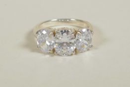 A 925 silver and cubic zirconium three stone ring, approximate size 'O/P'