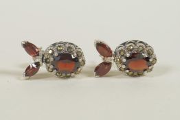 A pair of silver, garnet and marcasite set earrings