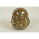 A bronze four faced Buddha head, 5" high