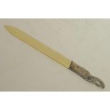 A bone letter opener with silver plated elephant's head handle, 10½" long