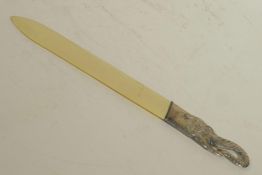 A bone letter opener with silver plated elephant's head handle, 10½" long