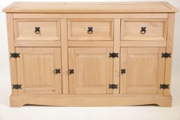 A pine dresser base with three drawers over three doors, 53" x 17" x 32" high