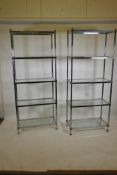 A pair of chrome and brass mounted five tier etageres/open shelves, with glass tops, 31" x 14" x 75"