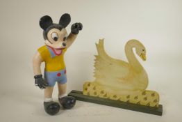 A carved and painted wood figure of a stylised Mickey Mouse, and a painted wood duck plaque, 16"