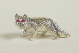 A sterling silver figure of a fox with ruby set eyes, 1½" long