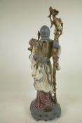 A Lladro figurine of a Chinese farmer (Shao Lao), by Jose Roig, manufactured between 1977 and