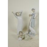 Three Lladro porcelain figurines, girl feeding geese, waking child and a sleeping angel, tallest 9½"