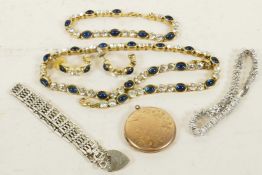 A hallmarked silver gate bracelet, a gold front and back locket, and other costume jewellery