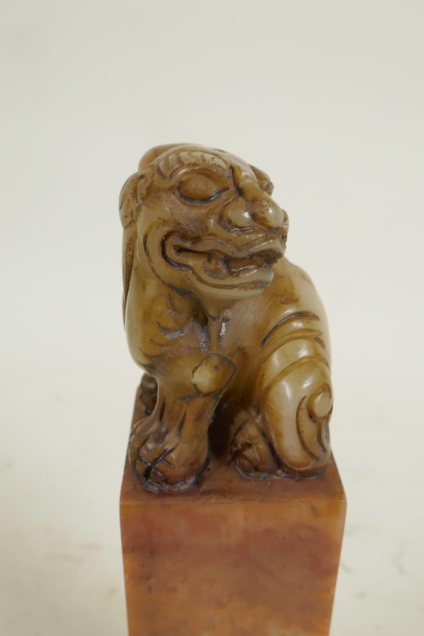 A square section Chinese carved soapstone seal, the top carved as a fo dog, 6" high - Image 2 of 4