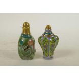 A Chinese polychrome porcelain snuff bottle in the form of a lotus leaf, and another similar, 4