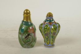 A Chinese polychrome porcelain snuff bottle in the form of a lotus leaf, and another similar, 4