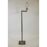 A brass and lucite standard lamp with cantilever arm