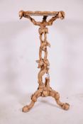 A carved and pierced wood jardiniere stand, modelled as a weasel chasing a mouse in a vine,