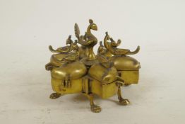 An Indian six section brass tika box decorated with birds, 5" diameter