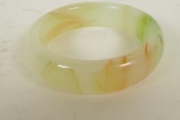 A Chinese banded hardstone bangle, 3¼" diameter