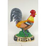 A painted cast iron doorstop in the form of a cockerel, 13½" high