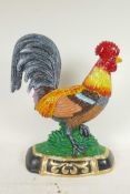 A painted cast iron doorstop in the form of a cockerel, 13½" high