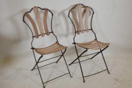 A pair of C19th French wrought iron and beech slatted folding garden chairs
