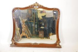 A walnut and parcel gilt overmantel mirror, bears label from RJ Horner & Co, furniture makers and