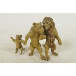 A cold painted bronze figure of three lions, 2½" high