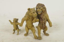 A cold painted bronze figure of three lions, 2½" high