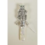 A sterling silver novelty baby's rattle in the form of an anthropomorphic cat, with mother of