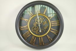 A decorative wall clock with quartz movement and open gear decoration with cut out Roman numerals,