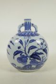 A Chinese Ming style blue and white porcelain moon flask with two handles, decorated with fruit