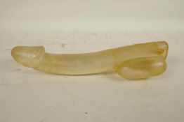 A large moulded glass phallic ornament, 11" long