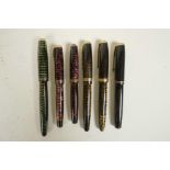 A collection of six Parker 'Vacumatic' fountain pens, US and Canadian made, with 14 gold nibs,