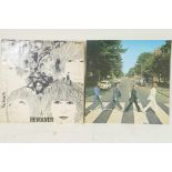 Two Beatles vinyl albums, 'Abbey Road' and 'Revolver', first pressings both used, covers split