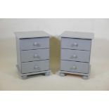 A pair of painted pine three drawer bedside chests, 17" x 15" x 23" high