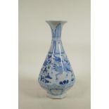 A Chinese blue and white porcelain pear shaped vase of octagonal form, decorated with mythical