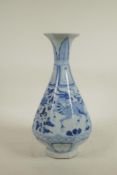 A Chinese blue and white porcelain pear shaped vase of octagonal form, decorated with mythical
