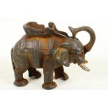 A cast iron trick moneybox cast as an elephant with howdah, 5" high