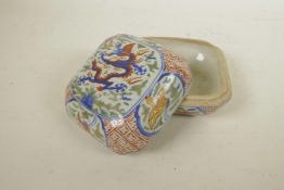 A Chinese Wucai porcelain box with crane and dragon decoration, 6 character mark to base, 5½" x 5½"
